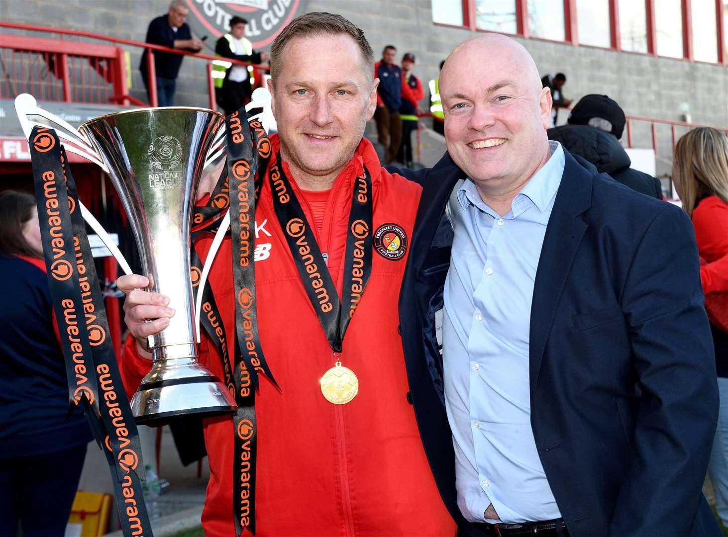 Dennis Kutrieb celebrates Ebbsfleet's 2022/23 National League South title win with chief executive Damian Irvine. Picture: Simon Hildrew