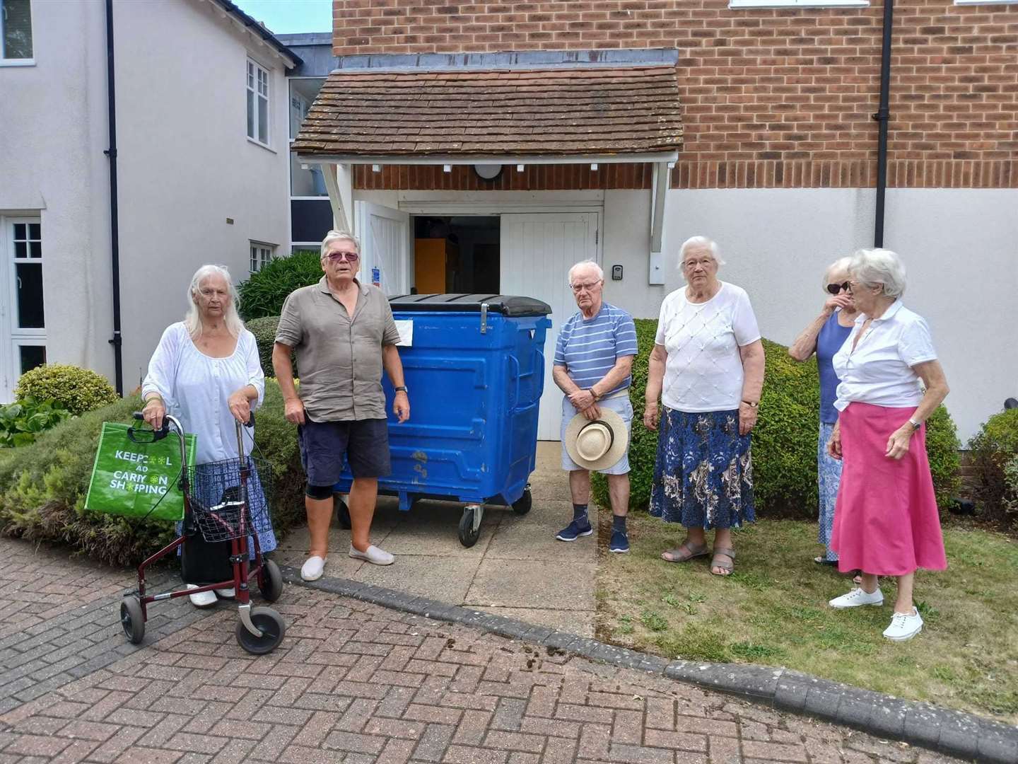 Trevor Bush, second from left, with other distraught residents of Culpeper Court