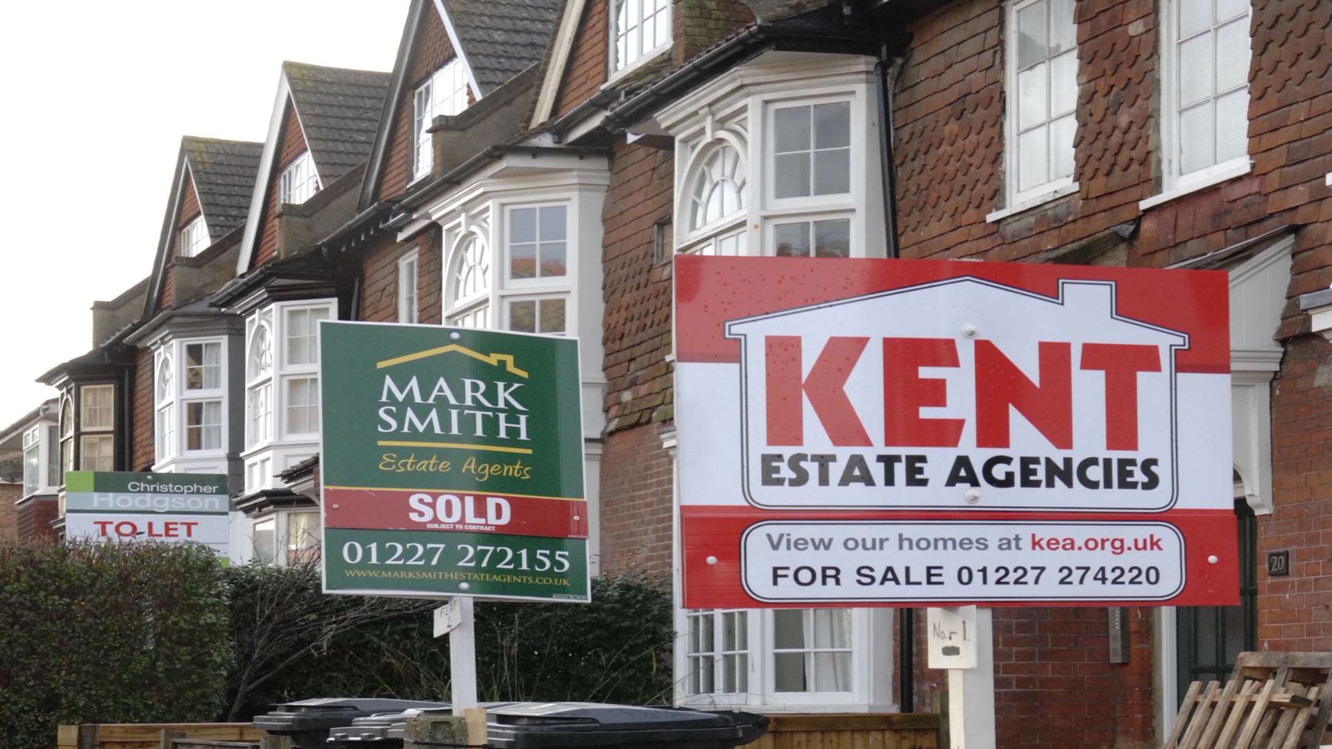 Estate agent signs in Tankerton Road, Whitstable