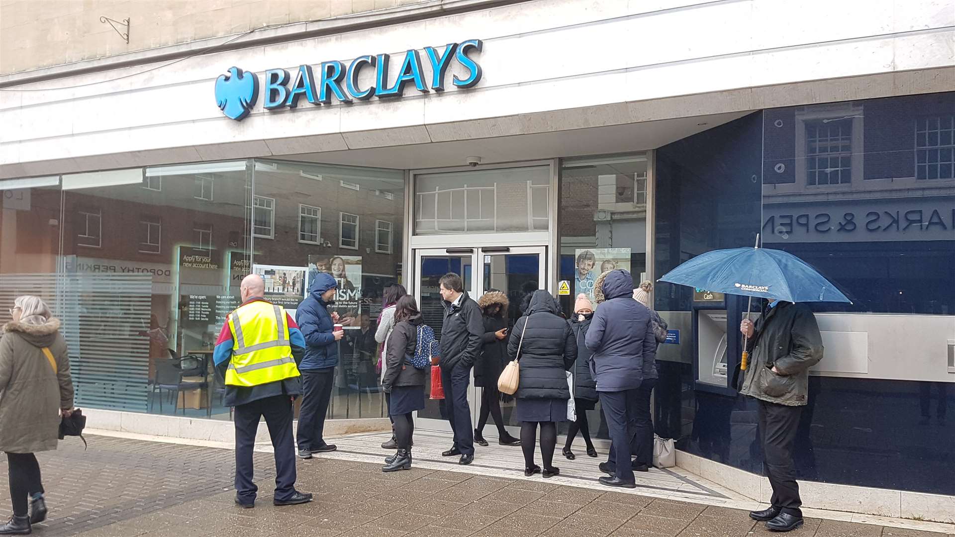 Workers outside the Canterbury branch, where protestors have superglued the doors