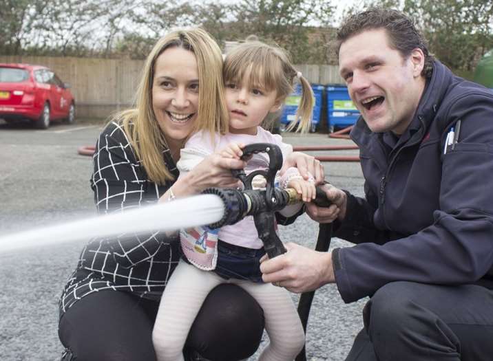 Cheryl Woodgate and her daughter with a Dartford firefighter