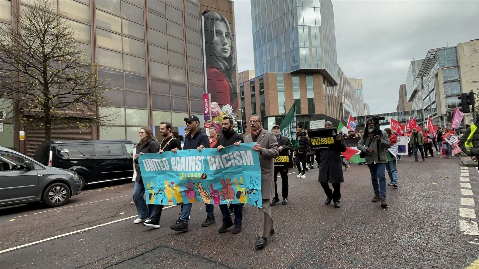 People take part in an anti-racism protest in Belfast on Saturday (Rebecca Black/PA)