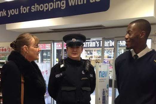 Co-ordinator Karen Griffiths with PCSO Chris Chapman and security guard at Boots, Seun Akerele.