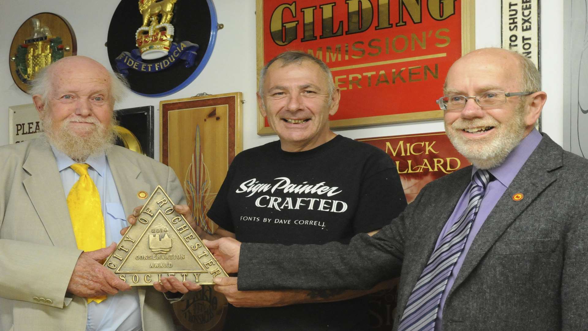 Mick Pollard gets the City of Rochester Society conservation award. L-R: Bob Ratcliffe, Mick and Alan Moss