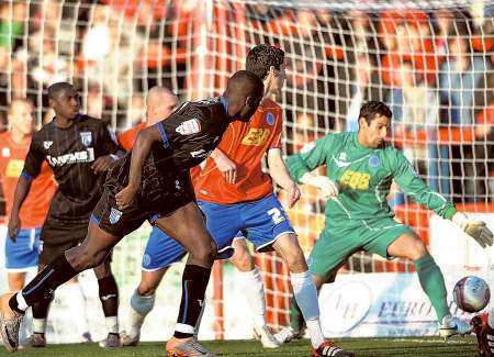 Frank Nouble scores the opening goal for Gillingham at Aldershot