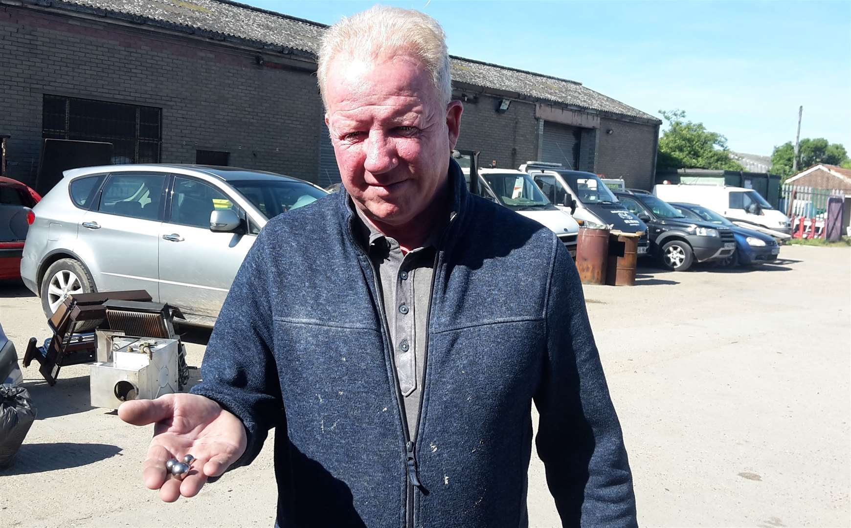 Martin Burford with the ball bearings being fired at his business, Sheppey Motor Salvage in Rushenden Road, Queenborough