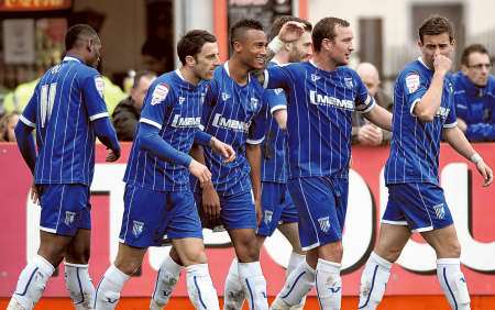 Gillingham players congratulate Jordan Obita on his second goal