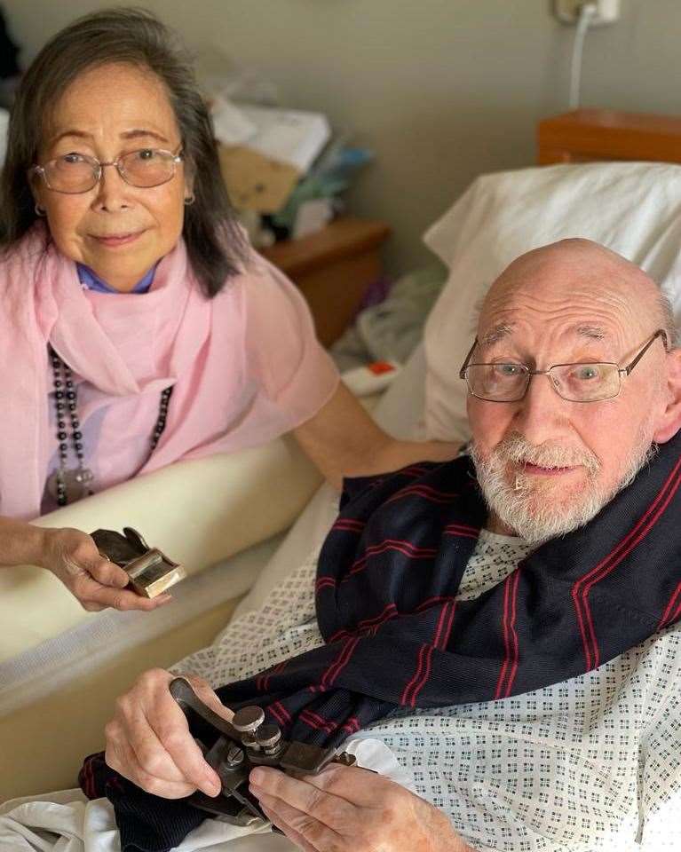 Roy Turnage holding one of his many planes alongside wife Nympha. Credit: Hansons