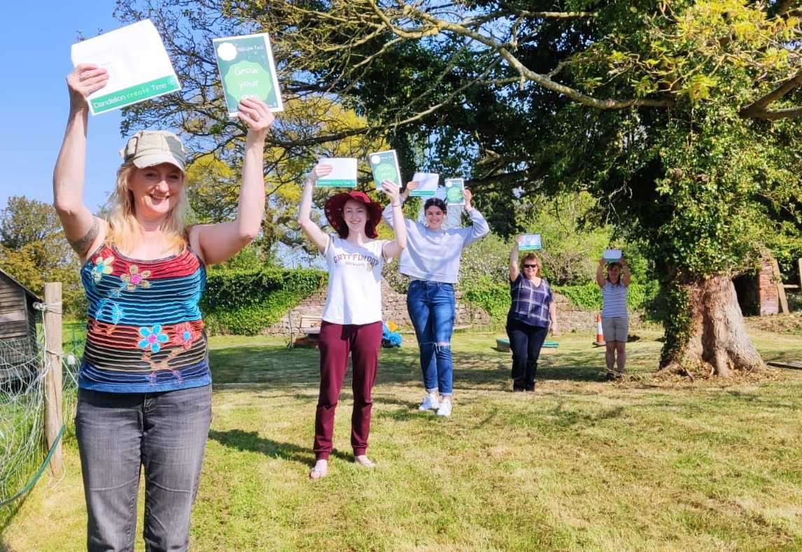 Volunteers preparing the activity packs for families Picture Dandelion Time