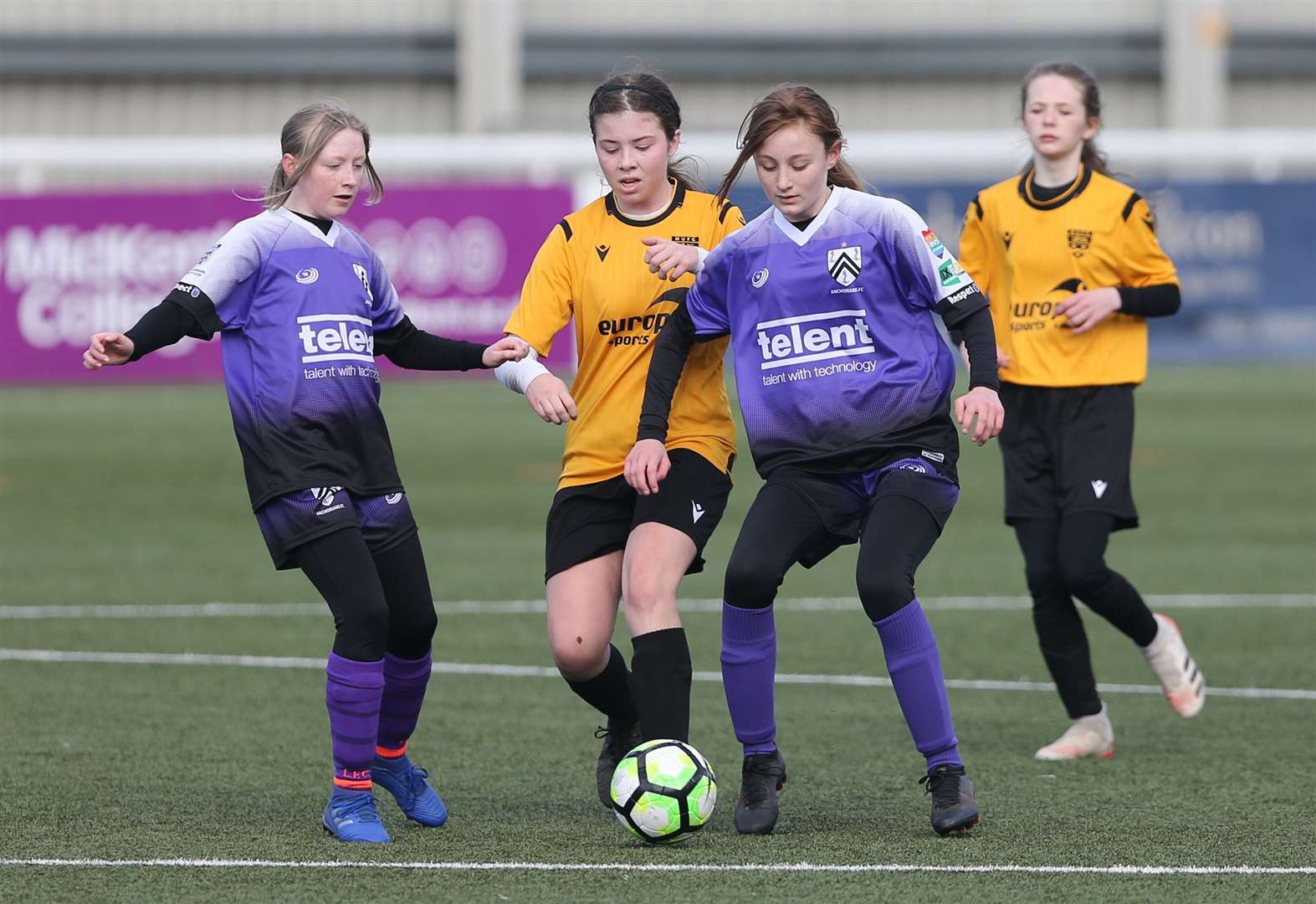 Anchorians (purple) double up to deny Maidstone United. Picture: PSP Images