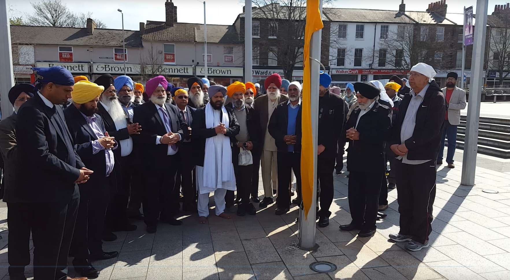 A traditional prayer was observed before the flag was raised.