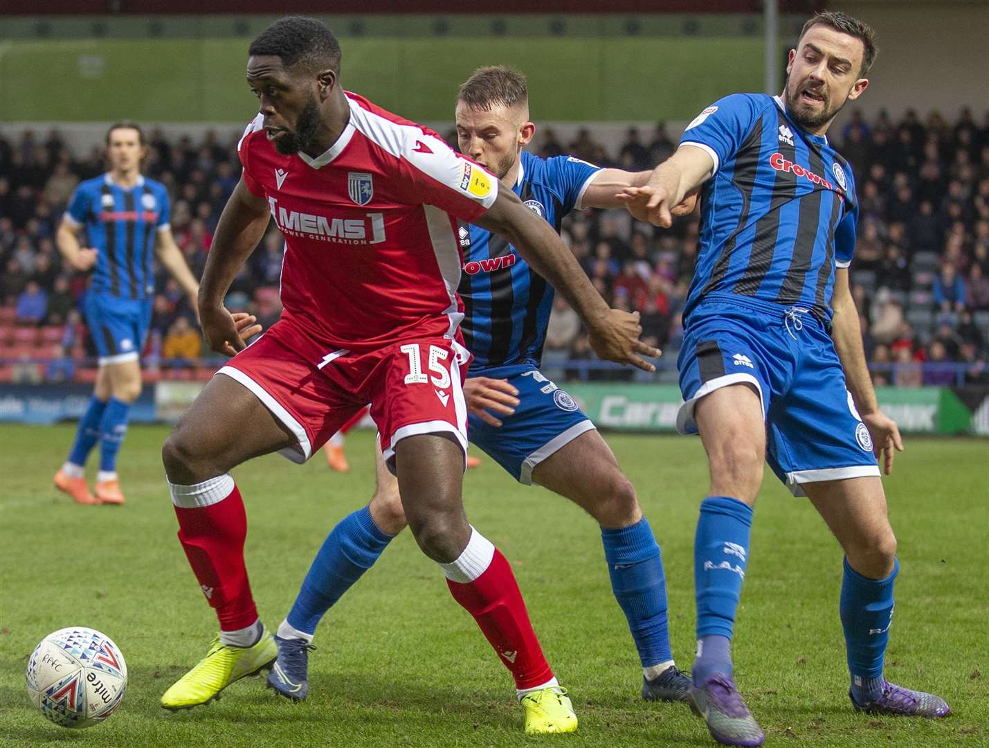 John Akinde holds off two Rochdale defenders Picture: Julian Hart