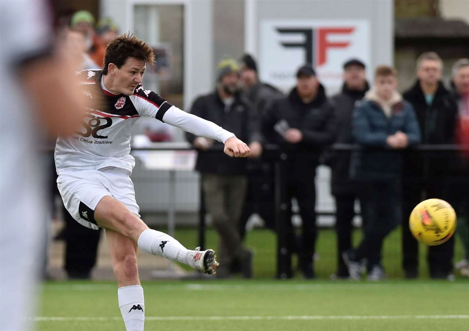 Billy Bennett puts Faversham ahead in the first half. Picture: Ian Scammell