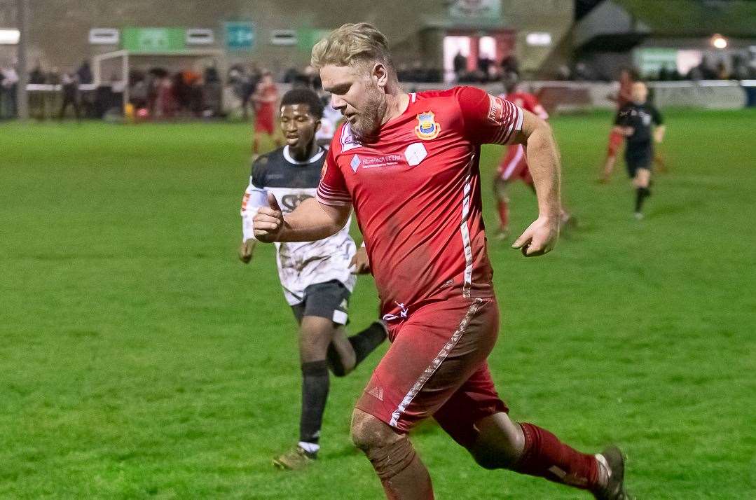 Whitstable striker Harry Goodger runs down the line, with Faversham's Donvieve Jones in pursuit, during the Oystermen's 2-1 win at Salters Lane on Monday. Picture: Les Biggs