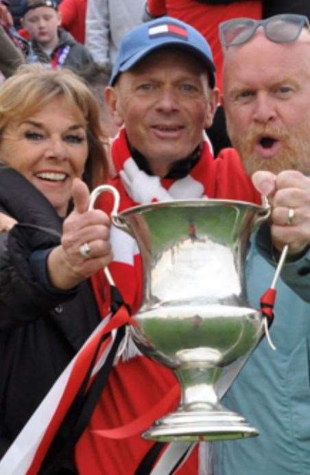 Liz Batten, Ernie Batten and Andy Gray celebrate Sheppey winning the Southern Counties East Football League Premier Division title. Pic: Mark Richards