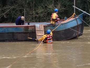 A woman is rescued off a house boat in Maidstone. Picture: Medway Coastgaurd