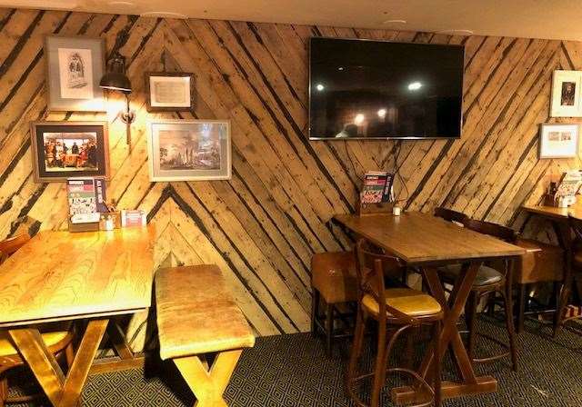 This area, at the back of the left-hand side of the pub, has more rustic wall decoration