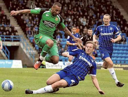 Connor Essam puts in a sliding tackle against Dagenham