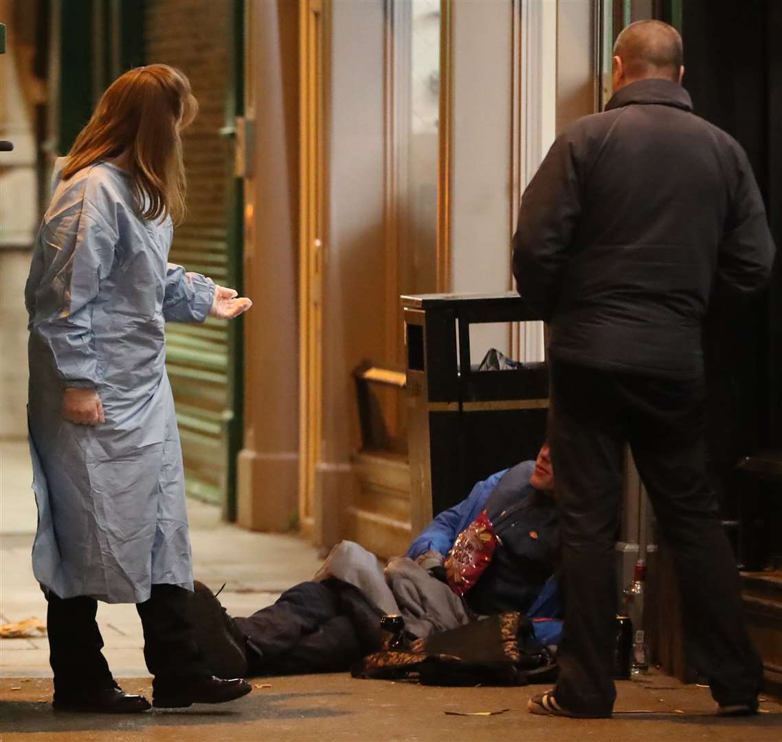 Inner City Helping Homeless volunteers help a rough sleeper in Dublin city centre (Niall Carson/PA)