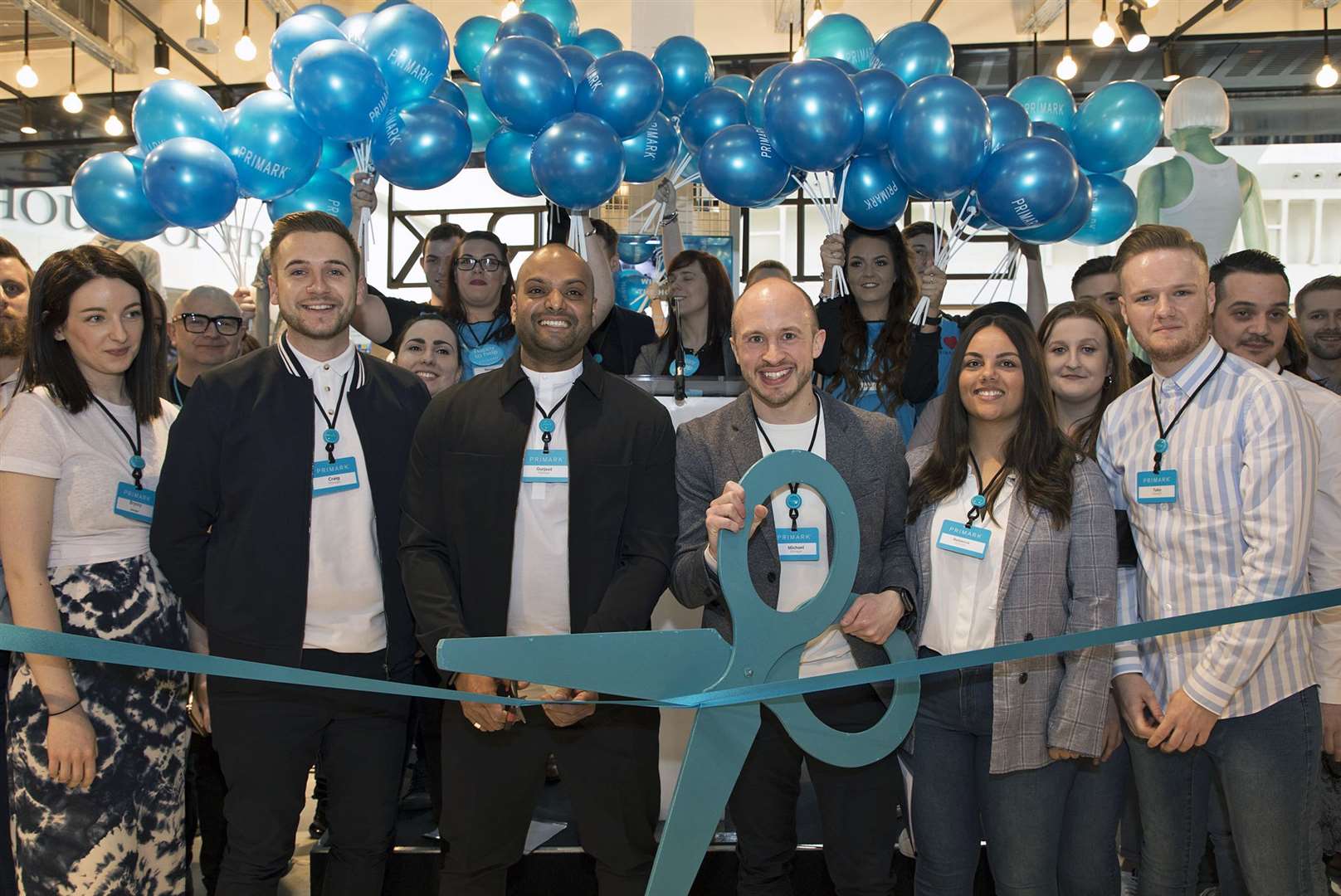 Staff and shoppers headed to the ribbon cutting earlier this morning. Picture: Primark (7758270)