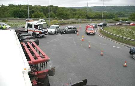 The lorry on its side with a damaged car in the background. Picture: MIKE MAHONEY