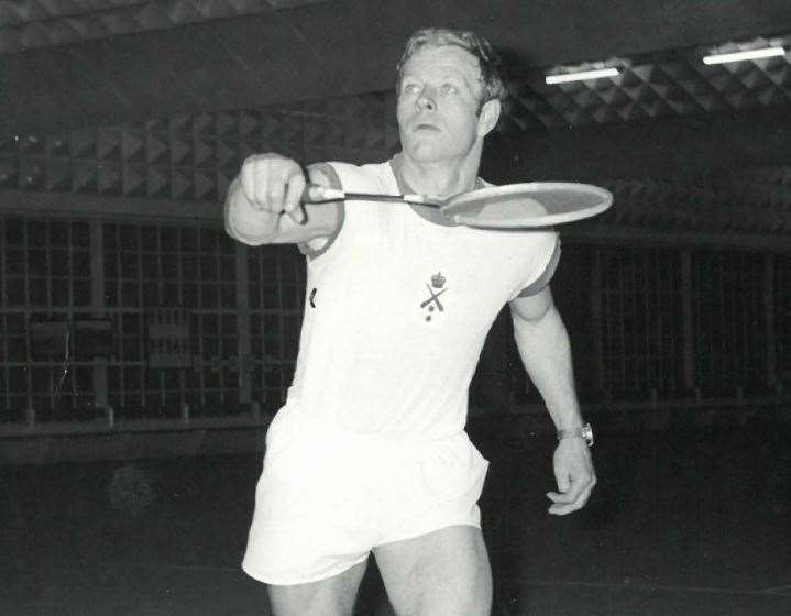 Mr Higgins playing badminton