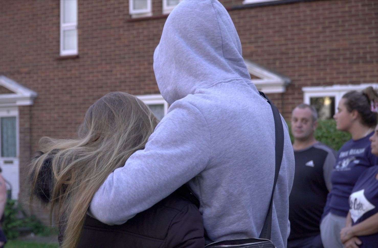 People comforting one another at Kieran Byrne's balloon release in Huntington Road, Coxheath