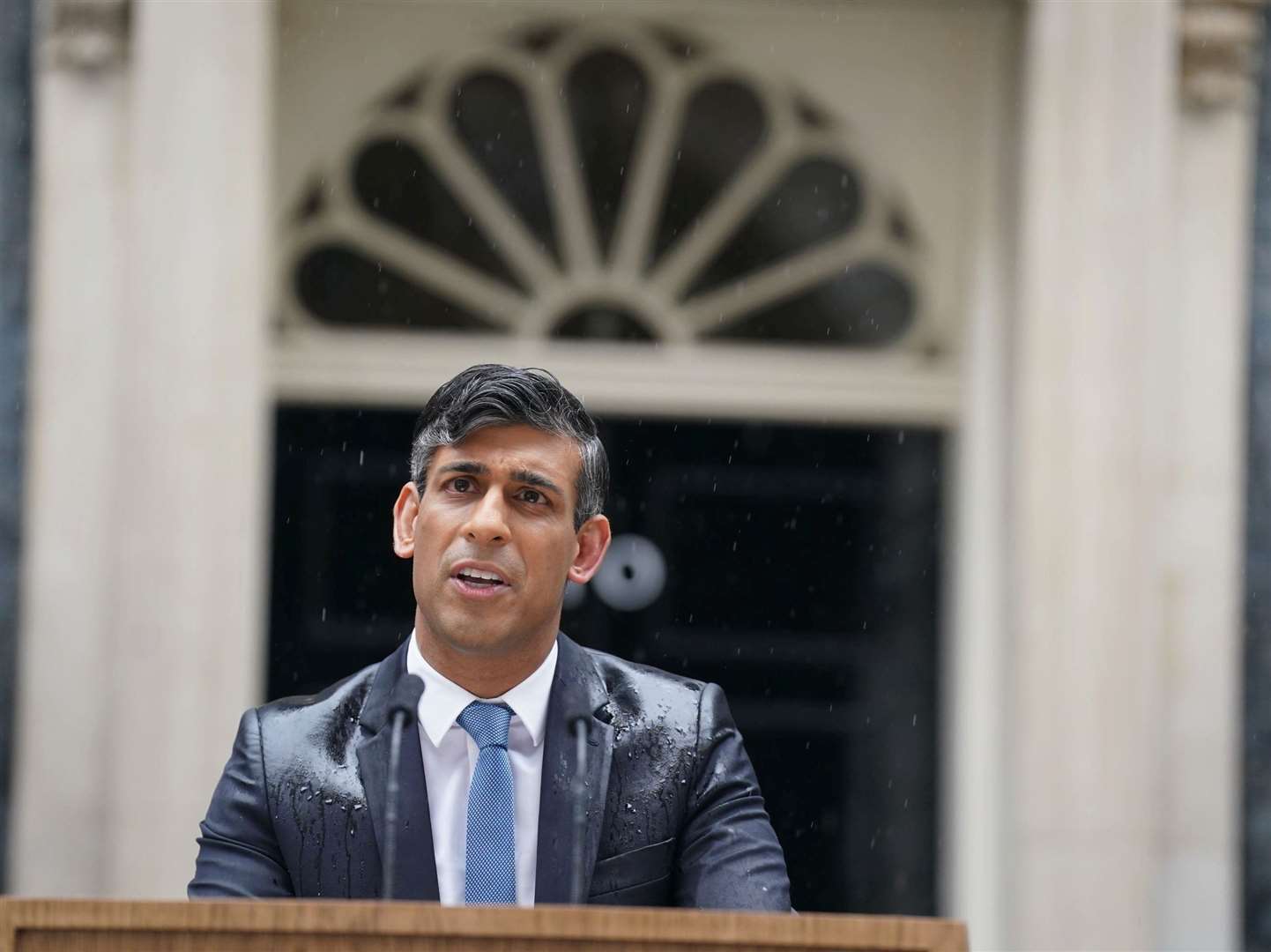 Prime Minister Rishi Sunak announces the election date in the rain outside 10 Downing Street. Picture: Stefan Rousseau/PA