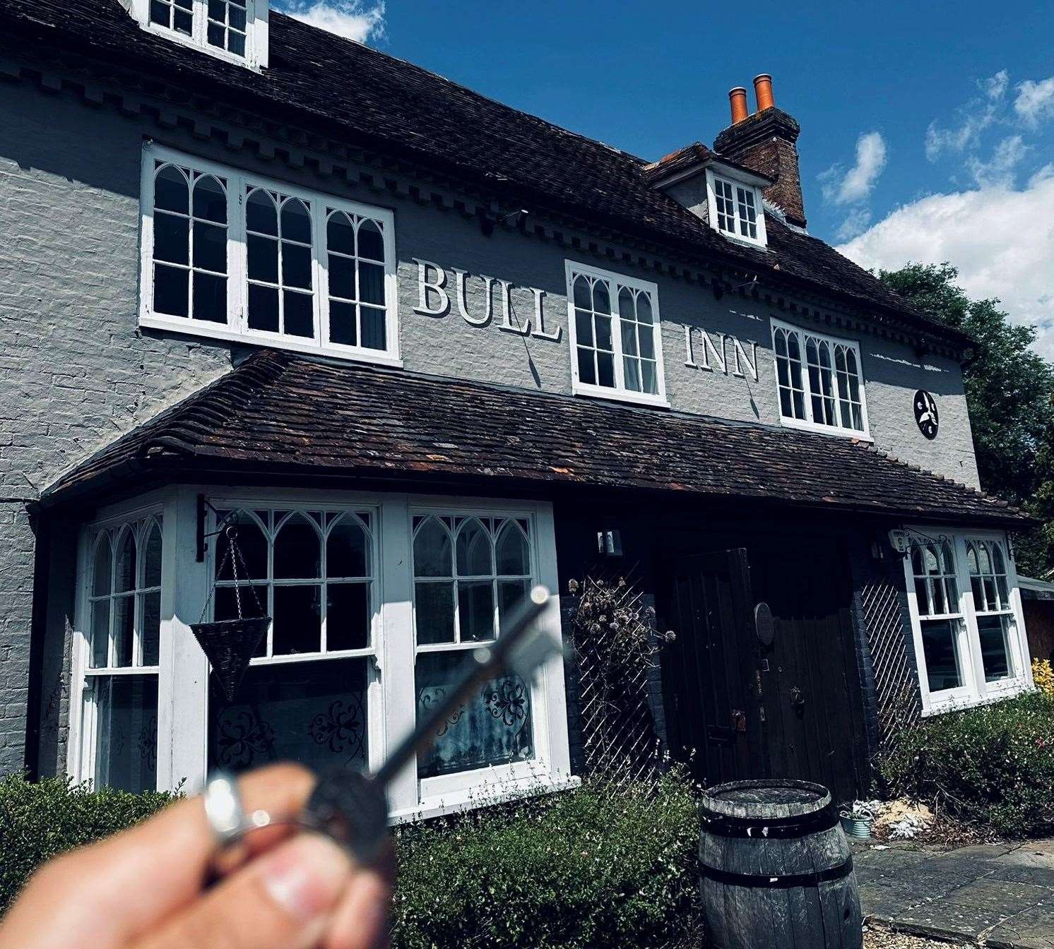 Stacy Reid with the keys to The Bull Inn following its reopening last month. Picture: The Bull Inn