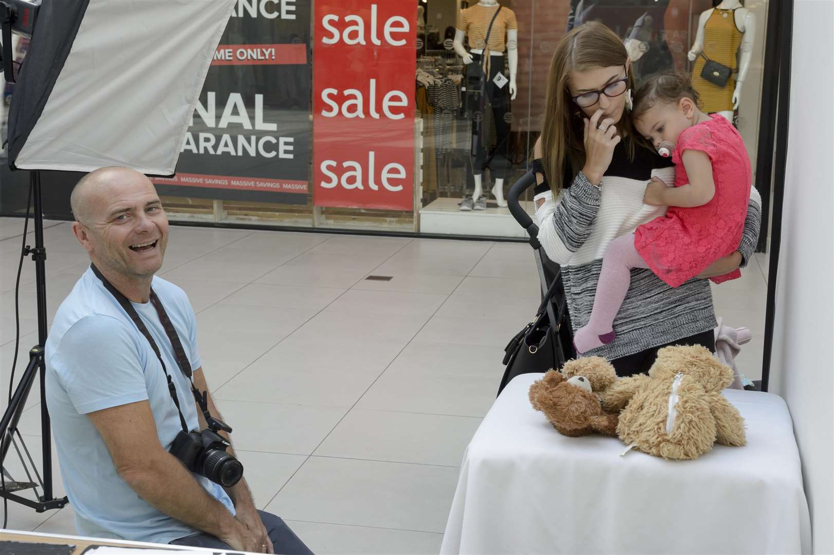 Cute Kids photographer Andy Nield with Yasmine Towner and Amelia, 2 at the launch of KM Maidstone Cute Kids Competition. Picture: Andy Payton (3358248)