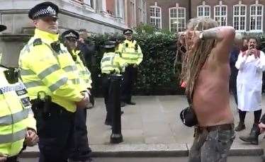 Police officers with protesters. Picture: @ToiletSeatBecky/Twitter (19098300)