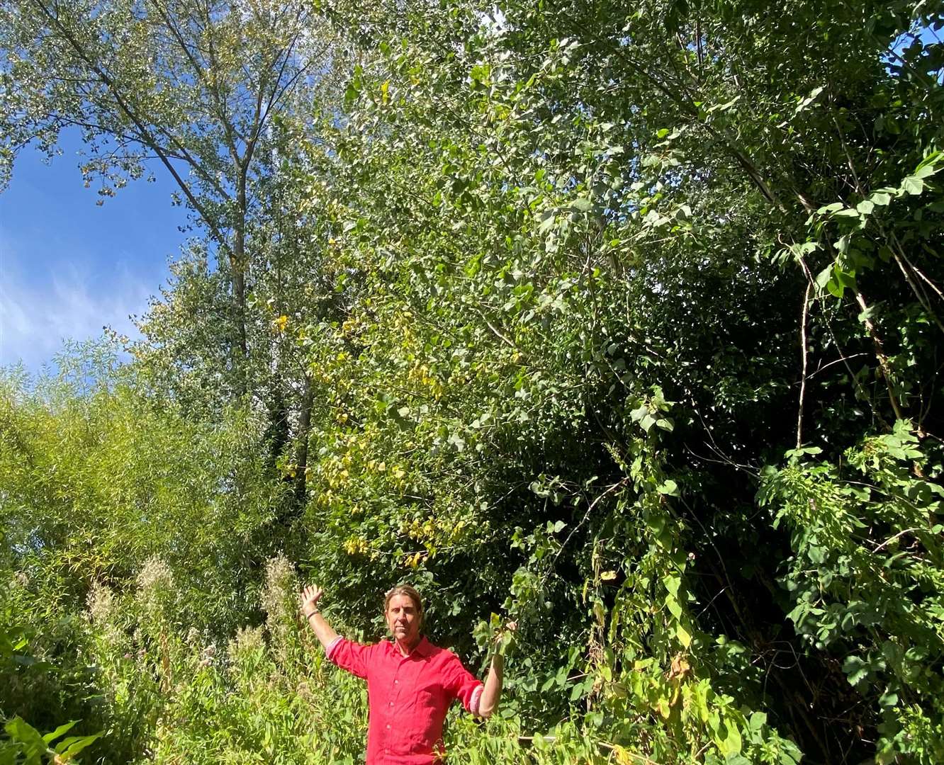 Len Valley Nature reserve chairman Tony Harwood in front of some of the hybrid black poplar trees which are to be felled