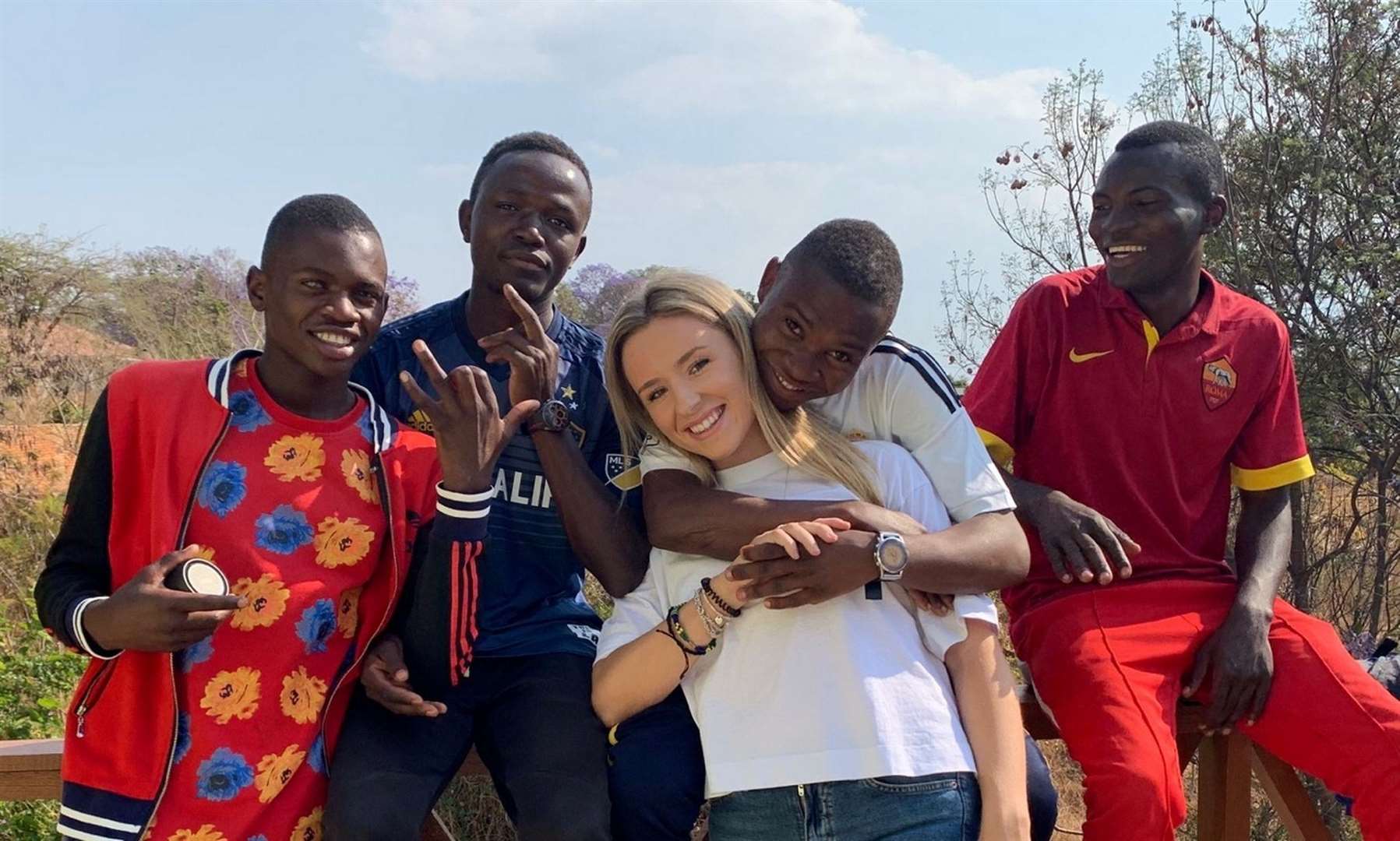 Letty with some of the Tanzanian children she met after volunteering in an orphanage on her gap year. Picture: Letty McMaster/SWNS