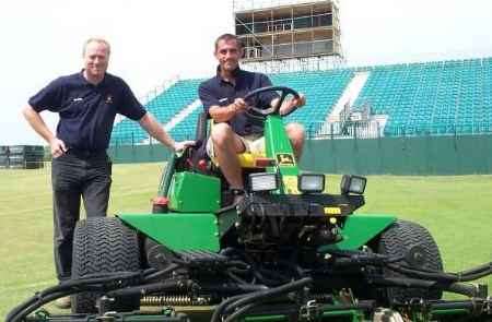 Neil Metcalf, left, with deputy head greenkeeper Graham Royden in front of the 18th green at Royal St George's