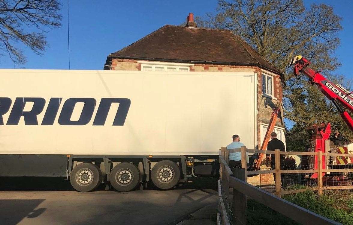 The lorry is lifted by crane around the bend at the top of Teasaucer Hill