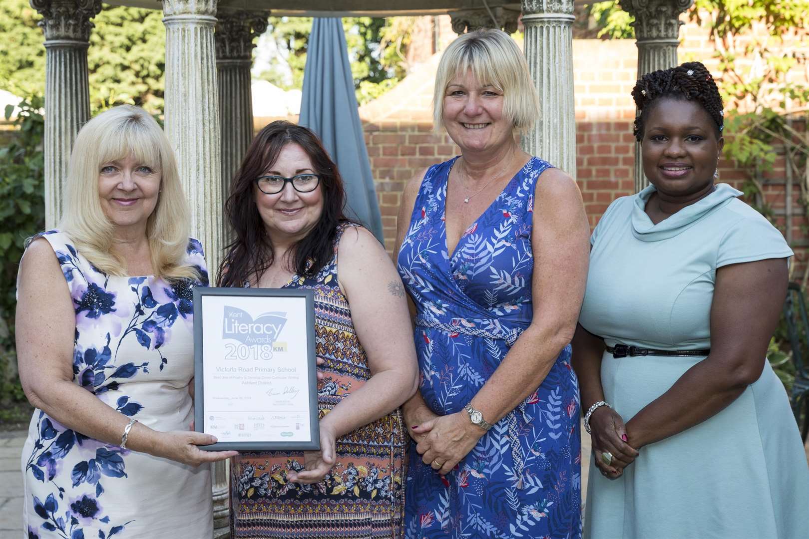 On right, Blessing Enakimio of Blessing by Ble, with Penny Bill of KCC and Debbie Hickman and Lynette Simmons of Victoria Road Primary School in Ashford at the Kent Literacy Awards 2018 at Hempstead House Hotel & Spa, Bapchild.