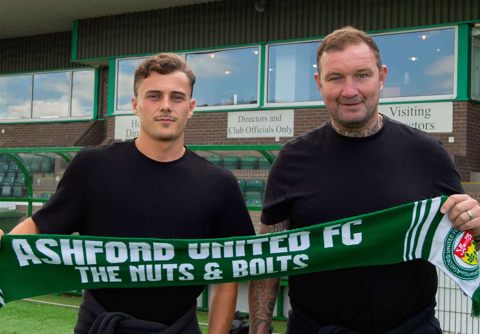 New Ashford striker Louis Collins is welcomed to the club by manager Danny Kedwell. Picture: Ian Scammell