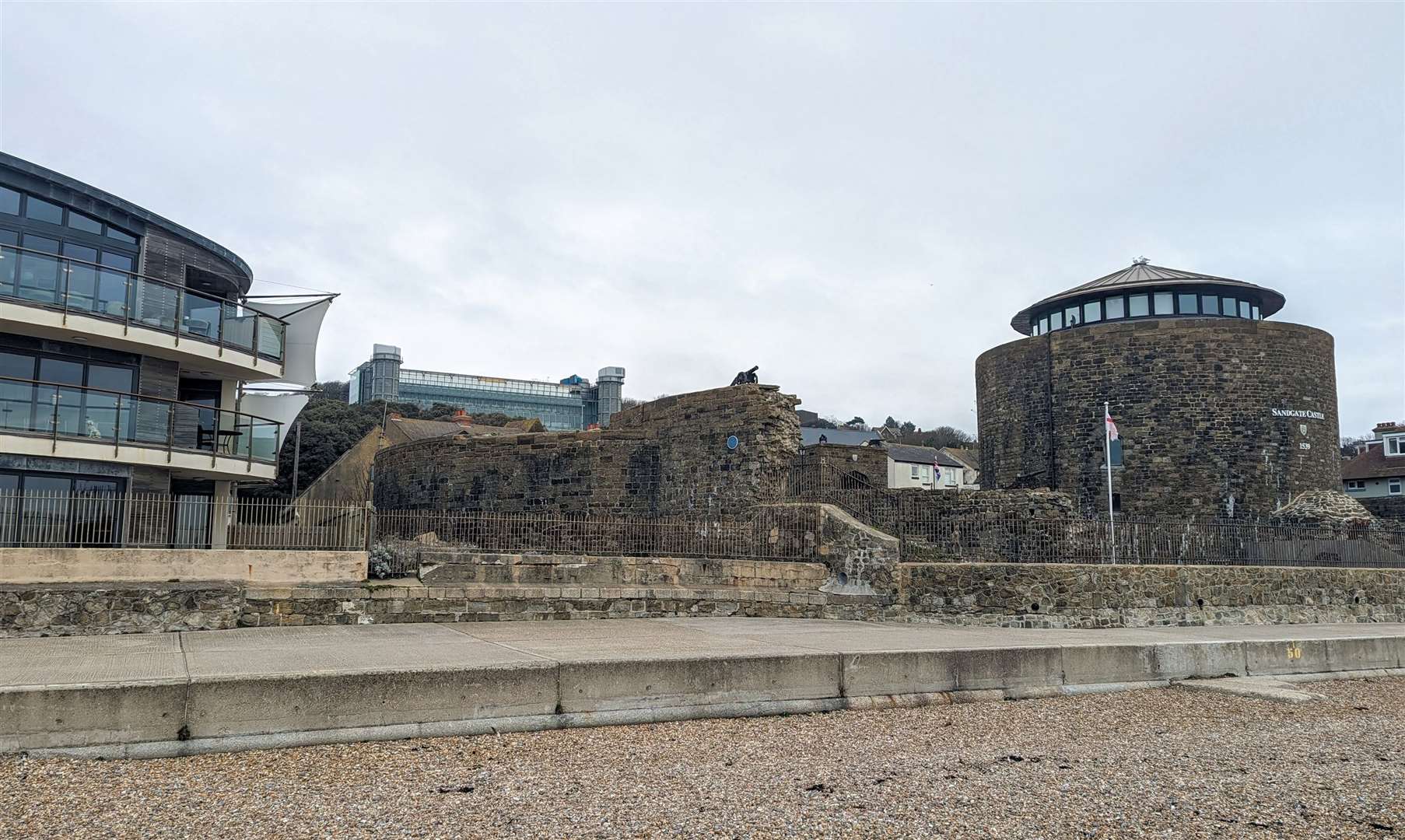 Saga's headquarters can be seen above the rooftops from the beach at Sandgate