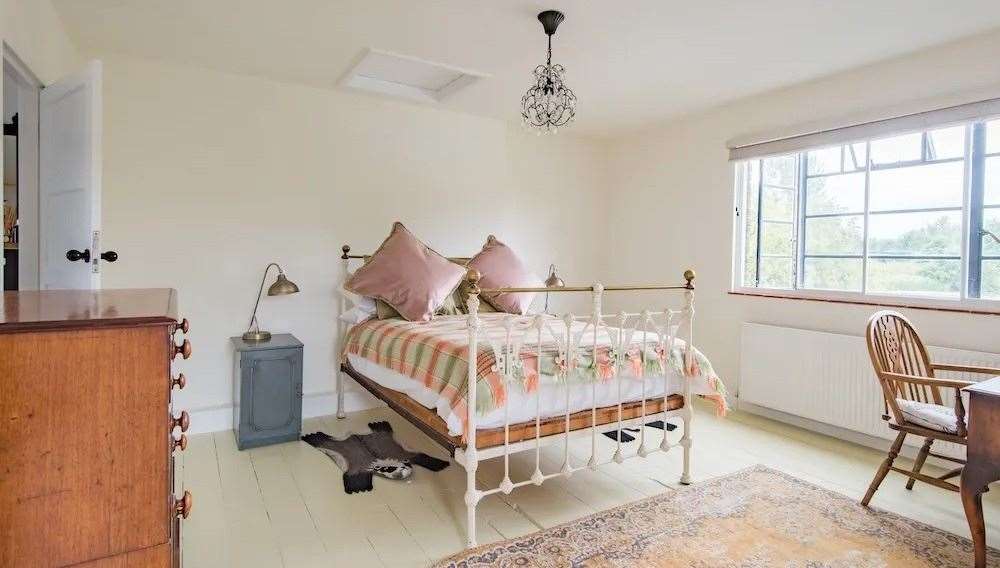 There are four bedrooms in the main house, including a master bedroom with an en-suite bathroom and great views. Picture: Unique Property Company