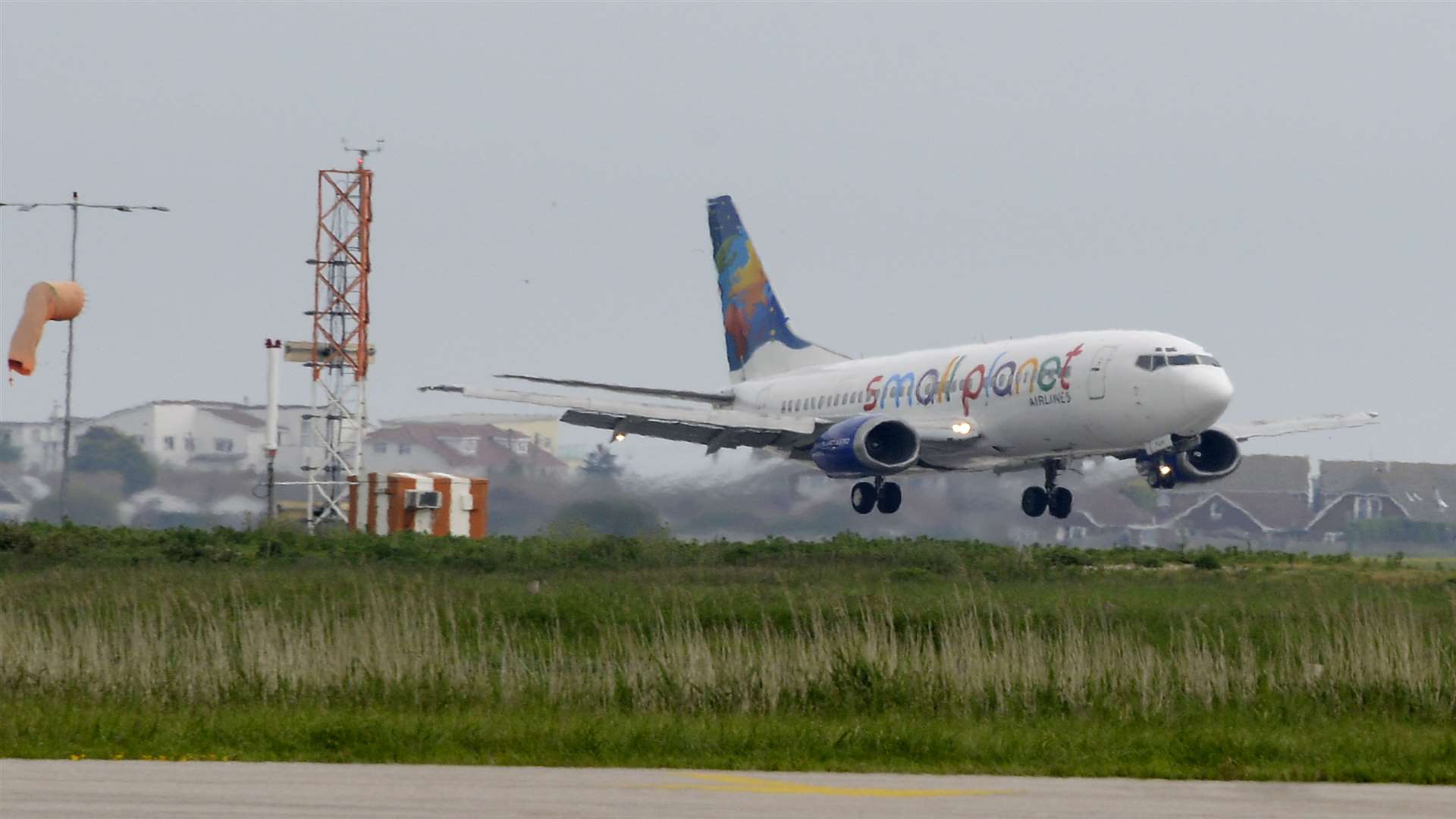 The first passenger airliner touches touches down at Lydd in June 2014