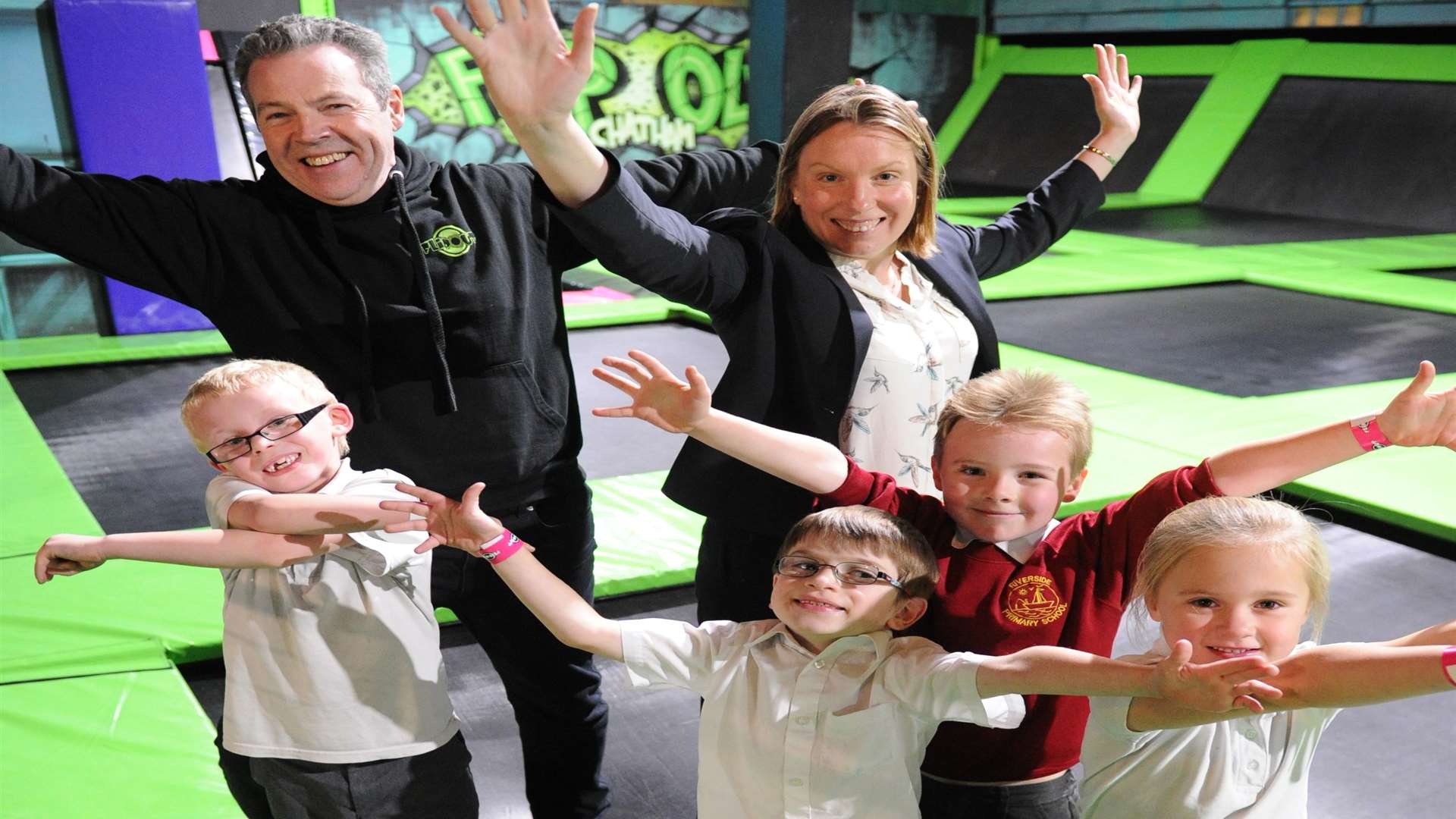 Mark McGill, director of Flip Out Chatham, Chatham MP Tracey Crouch and children from Riverside Primary School, Rainham