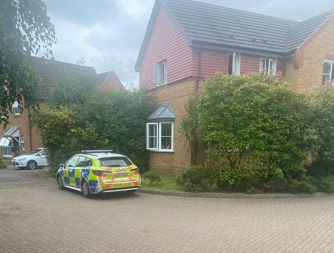 A police car parked in Wood Lane - a cul-de-sac in Park Farm, Ashford