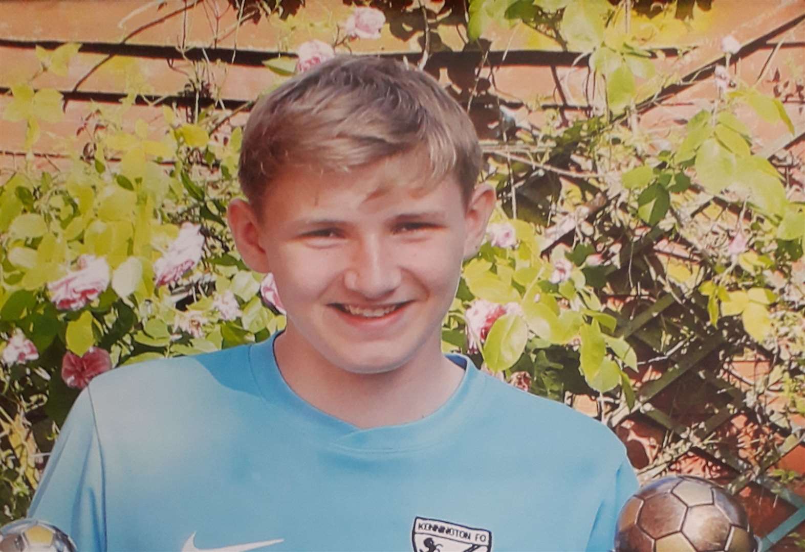 Owen Kinghorn pictured two years ago holding a player's trophy and the award for being the manager's player of the year