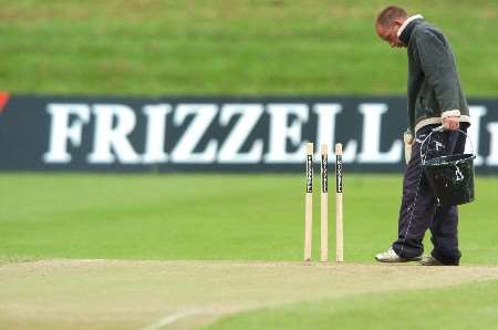 Grounds staff prepare the Mote pitch for the 3rd day's play at Maidstone. Picture by MATTHEW WALKER