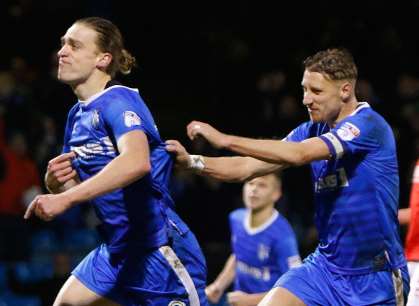 Tom Eaves celebrates with Lee Martin after scoring Gillingham's winner. Picture: Andy Jones