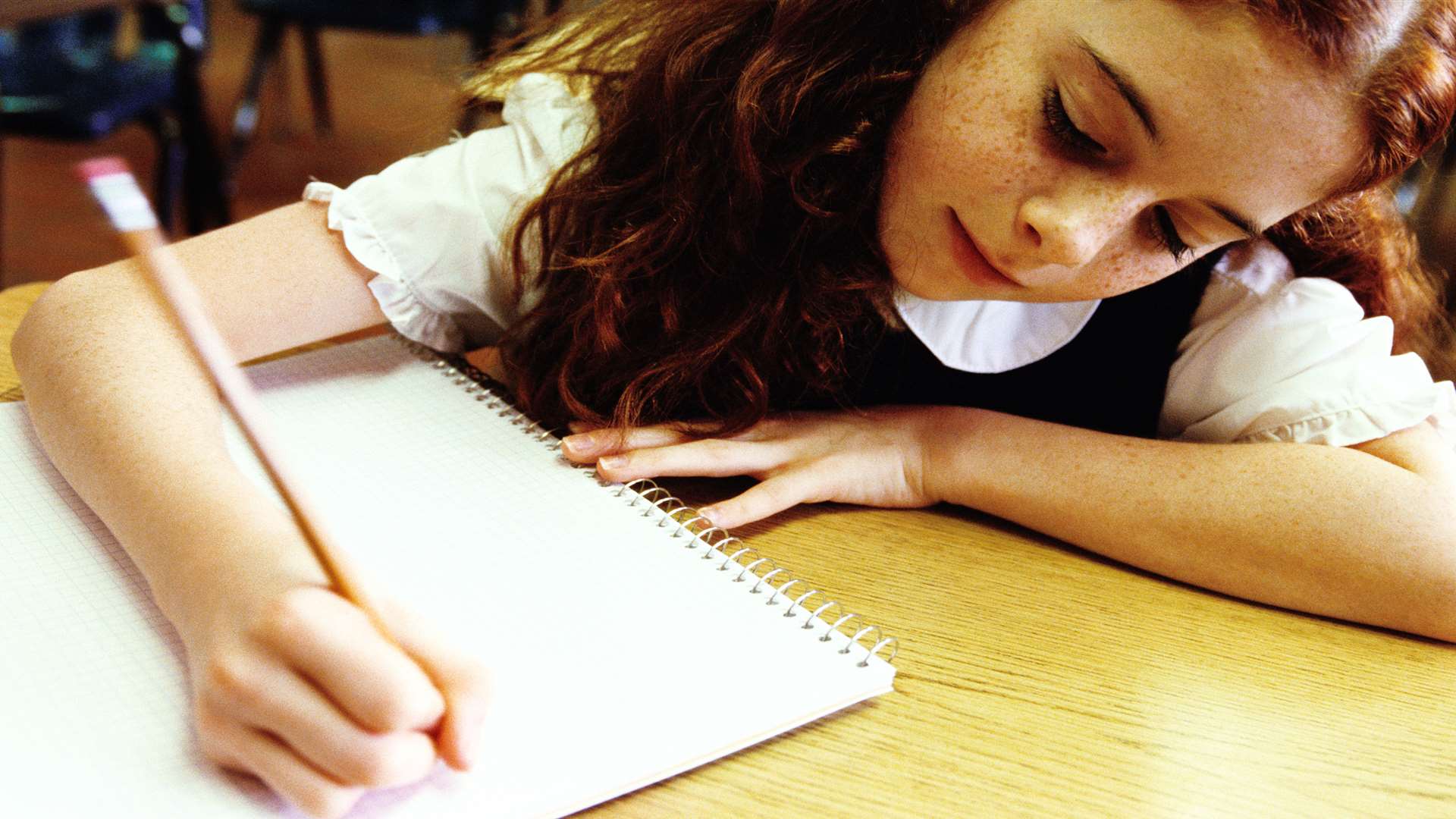 Girl sitting exam. Stock image.