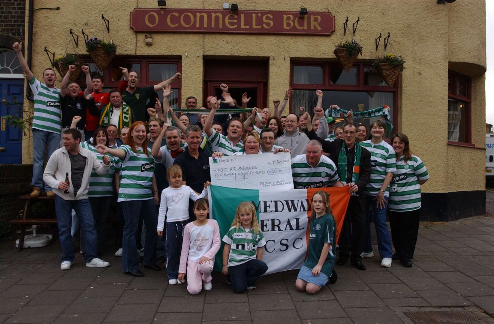 Maggie White and regulars of the O'Connell's pub in Chatham presenting a cheque to Kent Air Ambulance in January 2005. It later became the Railway Tavern but sadly closed in 2016. Picture: Jim Rantell