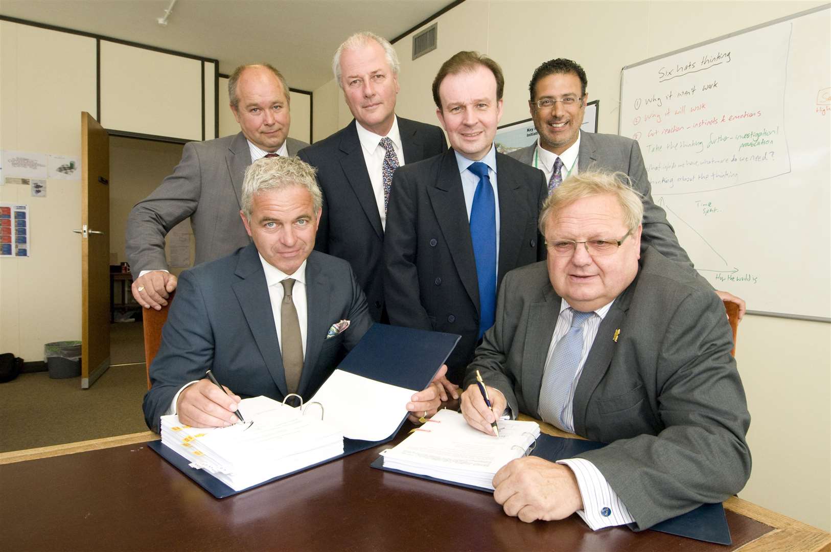 Signing of the Spirit of Sittingbourne agreement. Sitting left, Richard Upton of the Spirit of Sittingbourne Consortium and Andrew Bowles, former Swale council leader with then-Cllr John Wright, Pete Raine former regeneration director, Kent Cllr Roger Gough former Swale council chief executive Abdool Kara. Picture: Rob Canis