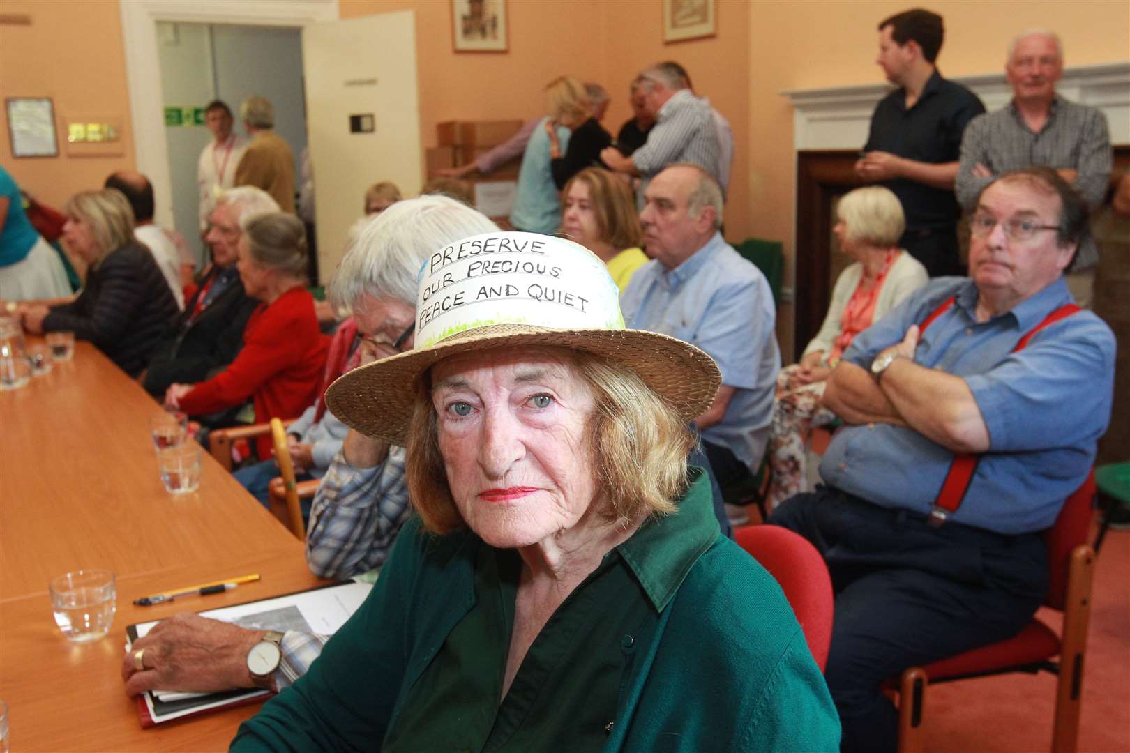 Diana Bullard, a West Malling resident, seated in an overspill room, expresses her opposition at the start of a public inquiry to build homes next to Malling Abbey. Picture: John Westhrop.. (15516488)