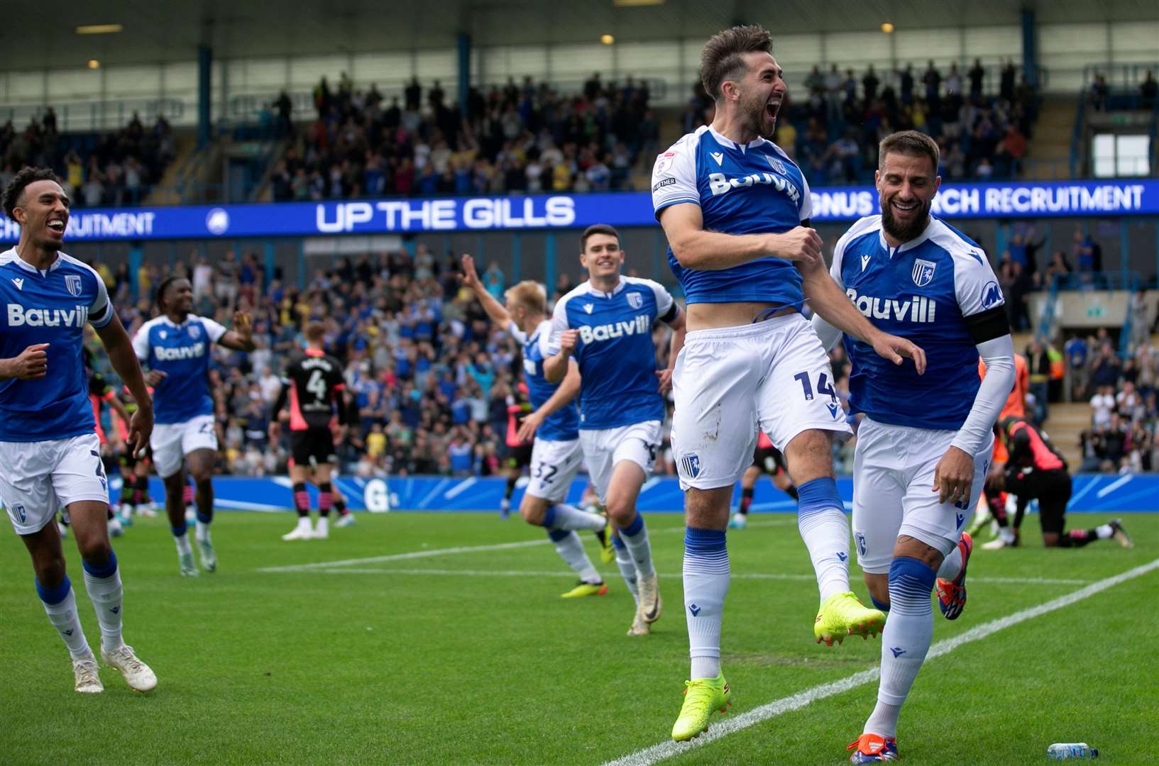 Robbie McKenzie celebrates his early goal for Gillingham against Chesterfield Picture: @KPI_Julian